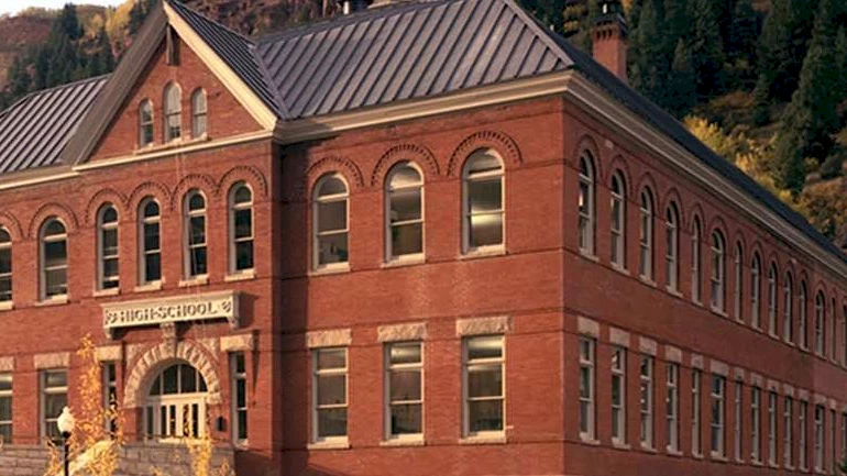 The historic red brick Telluride school building on Colorado Avenue